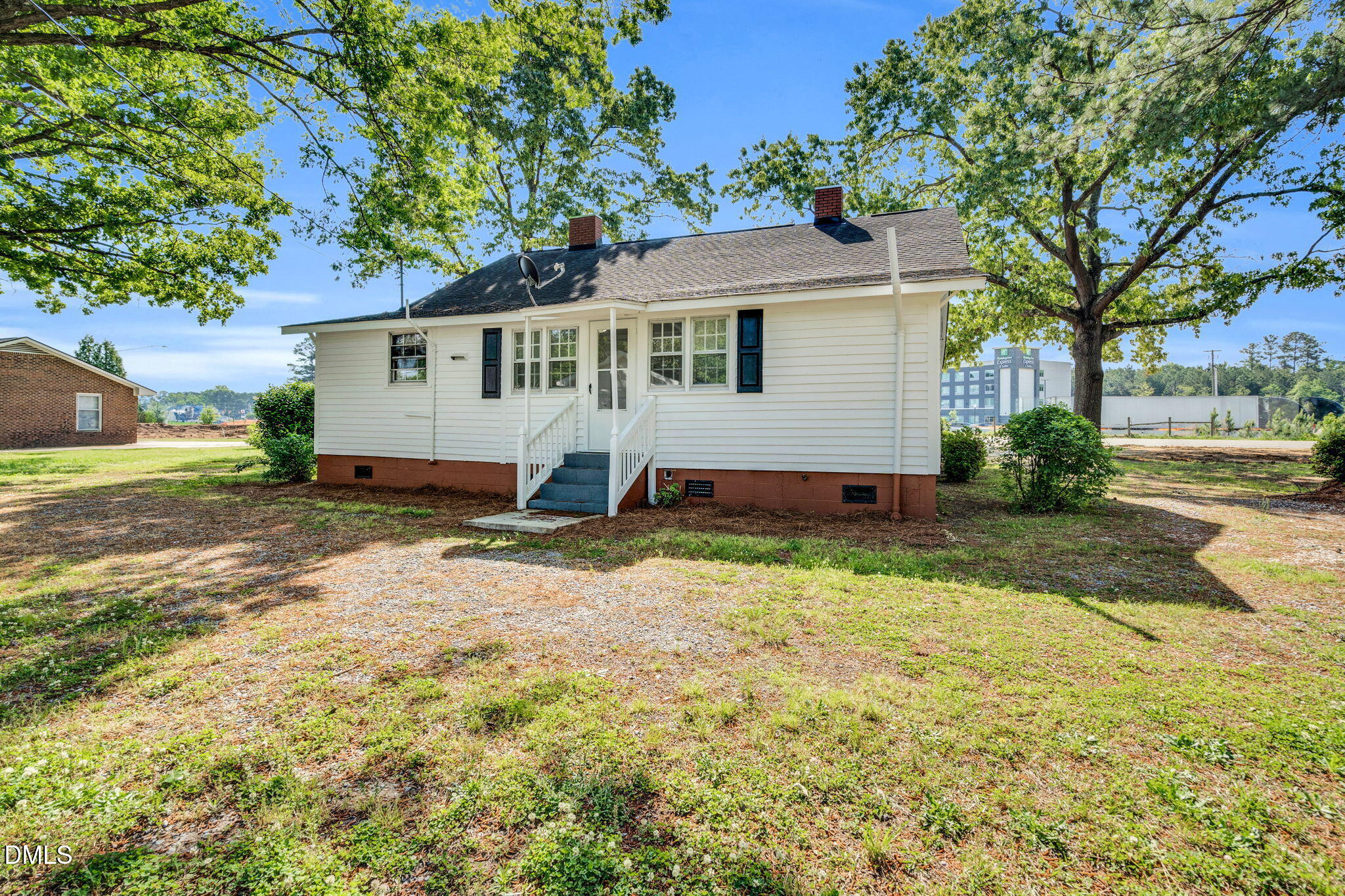 310 Chicopee Road Benson, NC 27504 - Photo 18 of 23 a view of a house with a yard