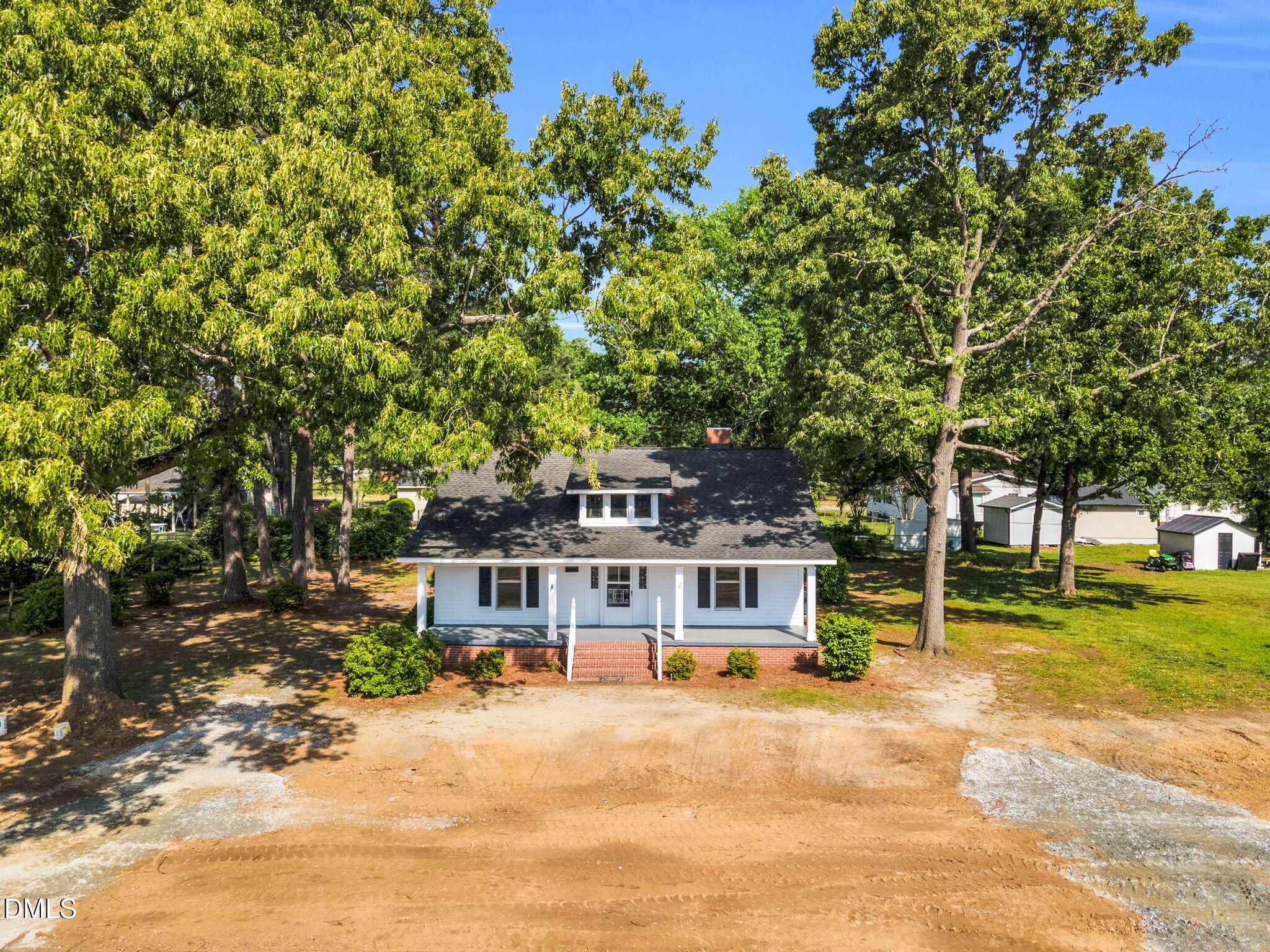310 Chicopee Road Benson, NC 27504 - Photo 2 of 23 a front view of a house with a yard