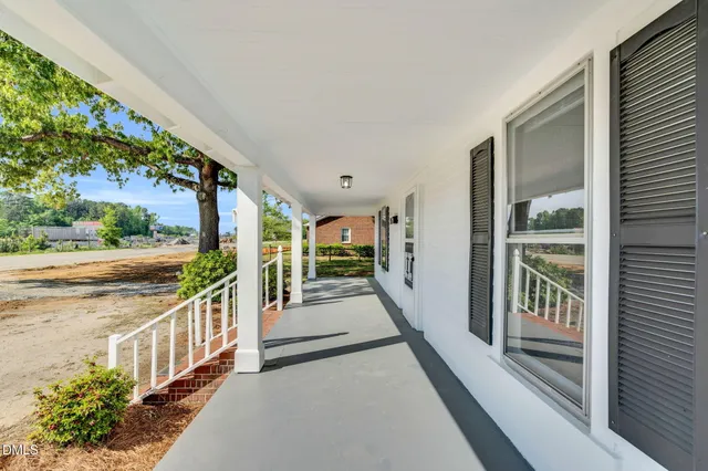 a view of a porch and garden