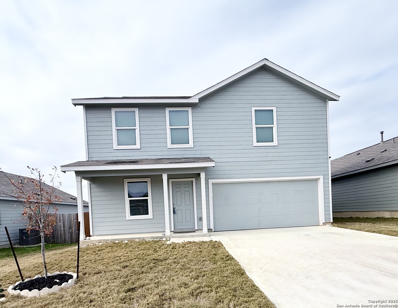 a front view of a house with a garage