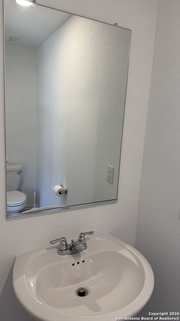 31885 Cherry Bulverde, TX 78163 - Photo 20 of 27 a bathroom with a sink and a mirror