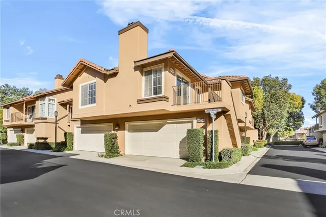 a front view of a house with a street