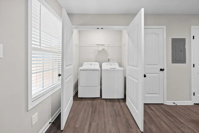a view of a storage & utility room with closet window