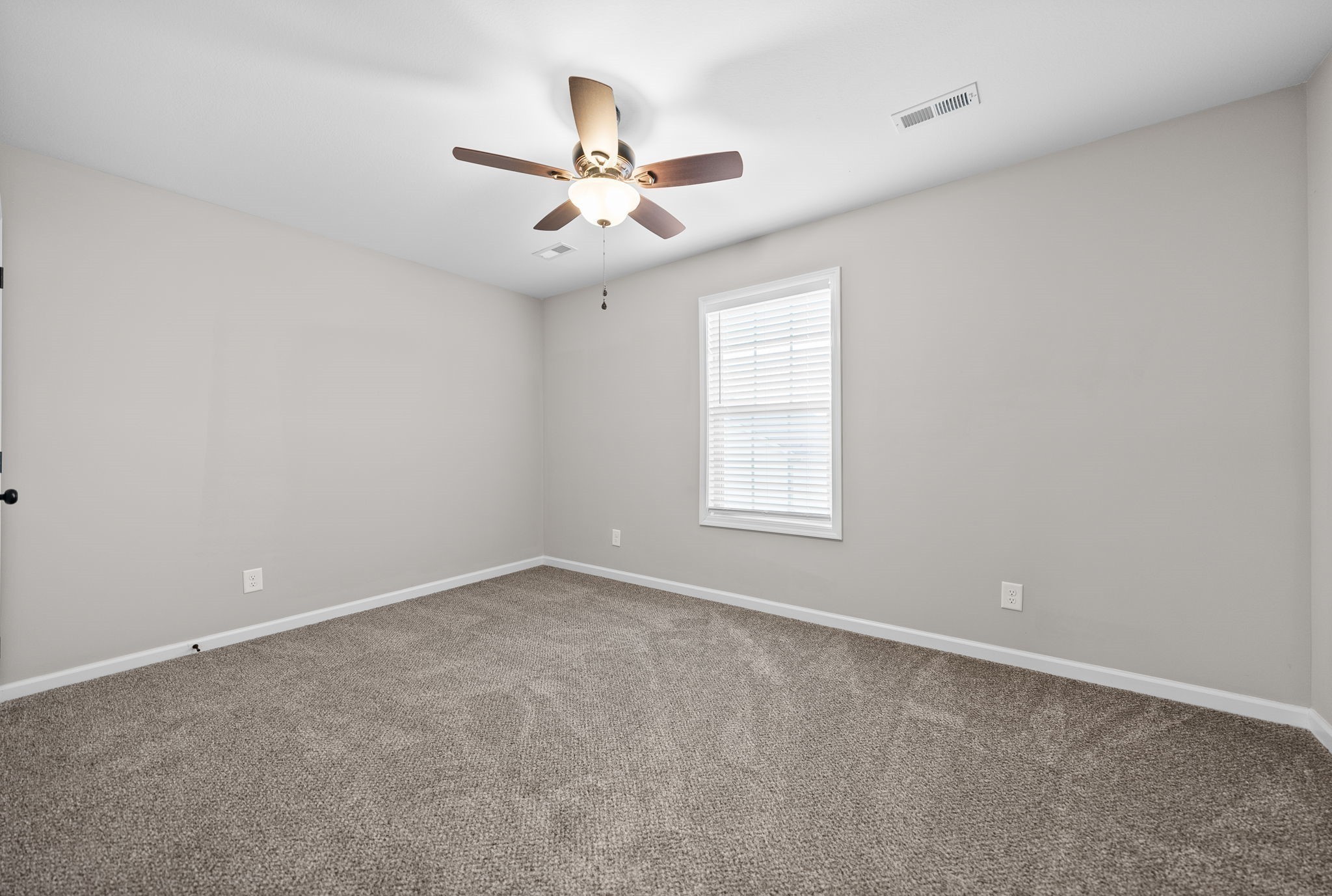 418 Peachers Mill Road, Unit C4 Clarksville, TN 37042 - Photo 15 of 21 an empty room with windows and ceiling fan