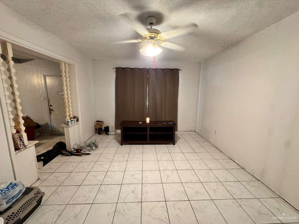 421 South Main Street Donna, TX 78537 - Photo 15 of 24 a view of a livingroom with a couch and a stove top oven