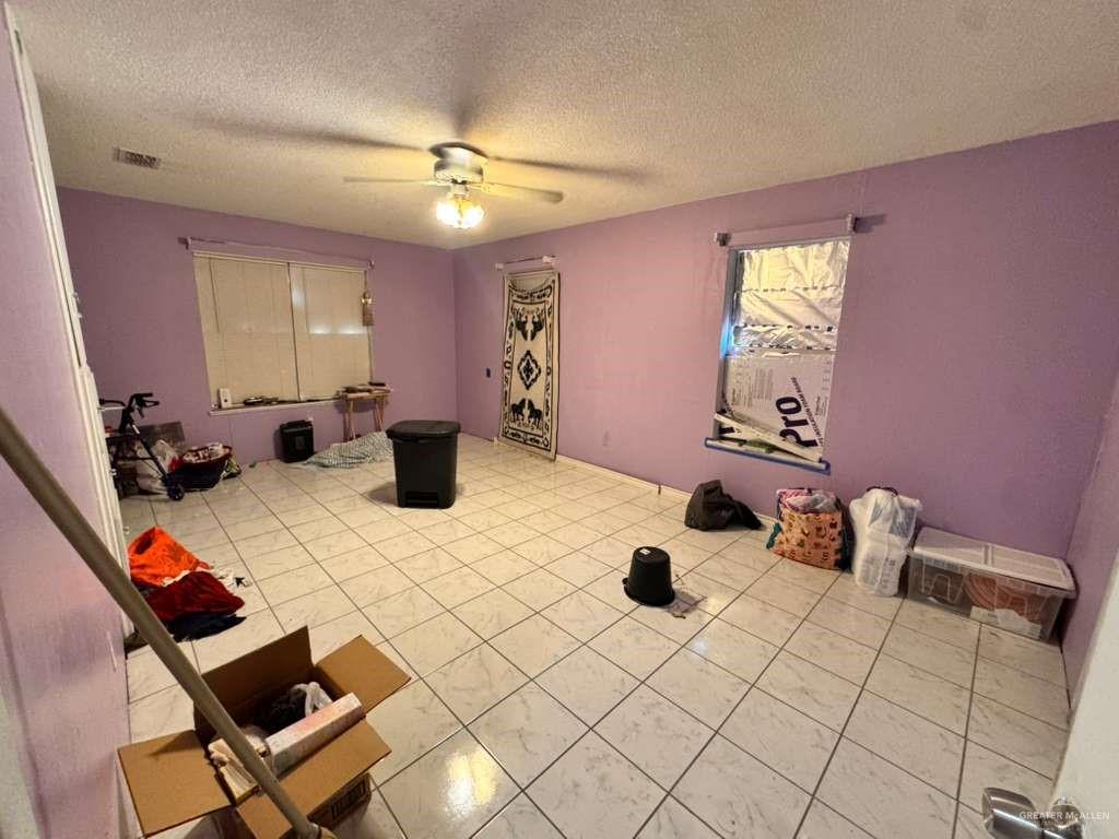 421 South Main Street Donna, TX 78537 - Photo 16 of 24 a living room with furniture and a chandelier