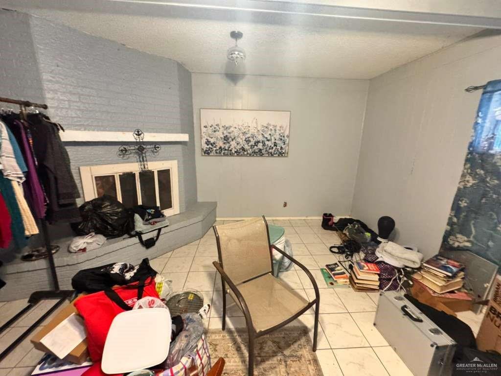 421 South Main Street Donna, TX 78537 - Photo 22 of 24 a room with furniture and a flat screen tv