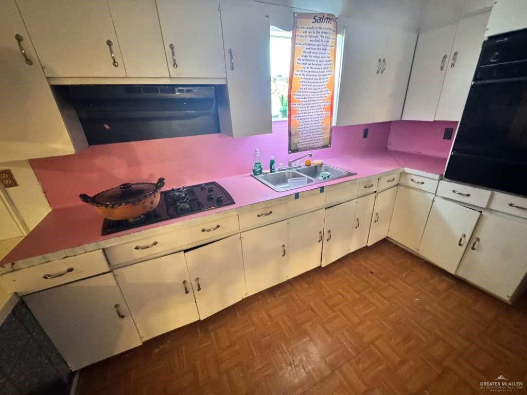 421 South Main Street Donna, TX 78537 - Photo 10 of 24 a kitchen with a sink and cabinets
