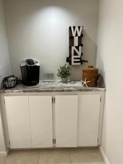 1605 Highway 1, Unit F204 Jupiter, FL 33477 - Photo 11 of 33 a bathroom with a sink and a mirror