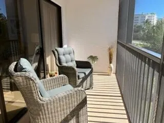 a view of balcony with furniture