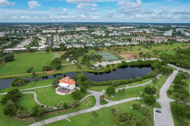 an aerial view of a residential houses with outdoor space and outdoor seating
