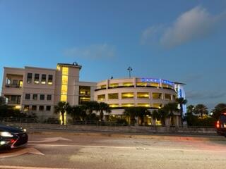 1605 Highway 1, Unit F204 Jupiter, FL 33477 - Photo 24 of 33 a front view of a building with street view
