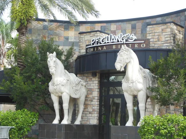 a front view of a house with outdoor seating and plants
