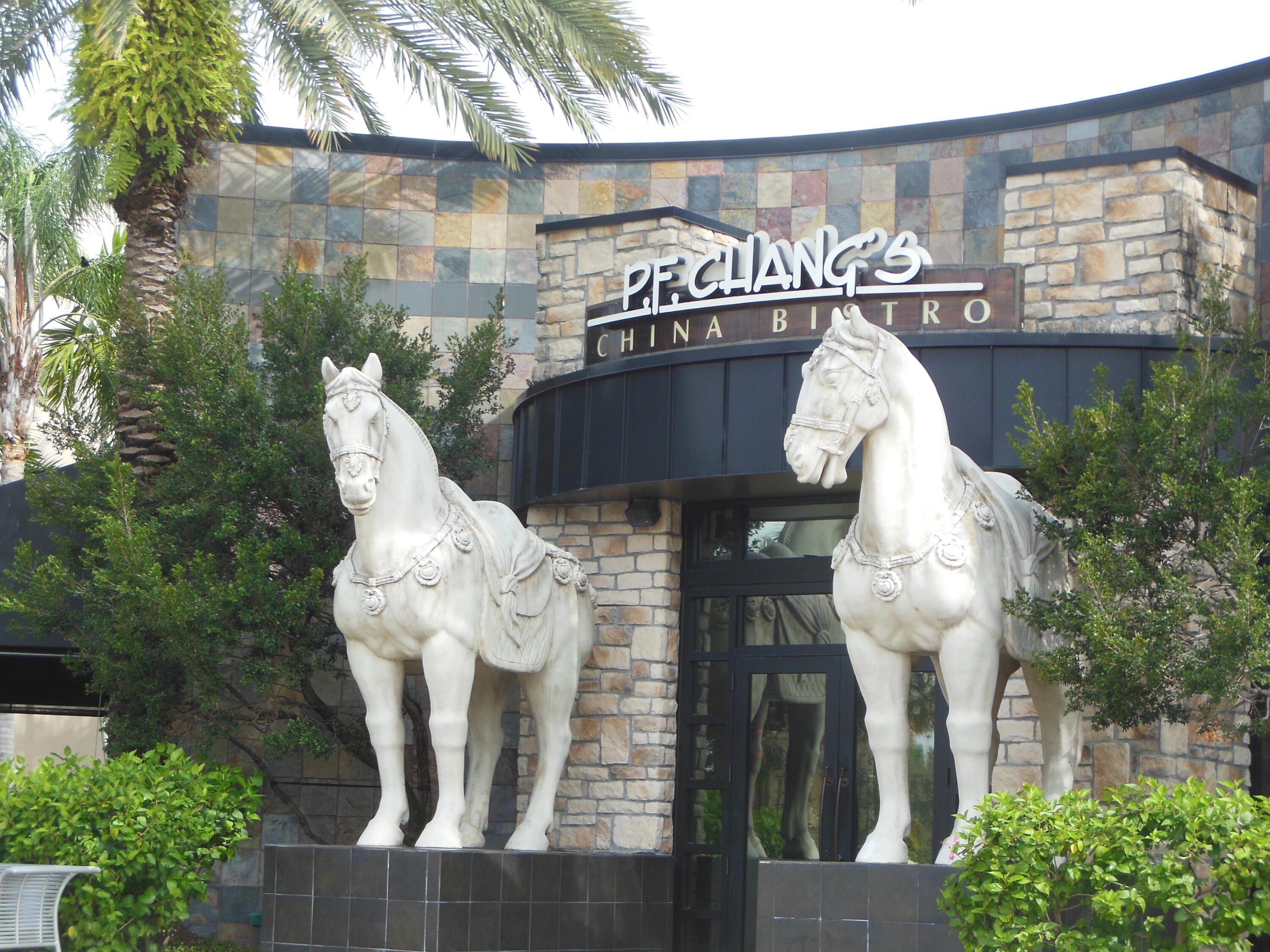 1605 Highway 1, Unit F204 Jupiter, FL 33477 - Photo 31 of 33 a front view of a house with outdoor seating and plants