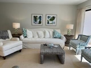1605 Highway 1, Unit F204 Jupiter, FL 33477 - Photo 5 of 33 a living room with furniture and a large window