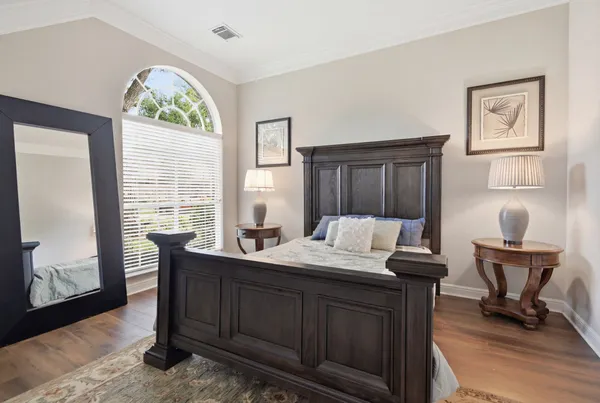 a bedroom with a bed and a couch