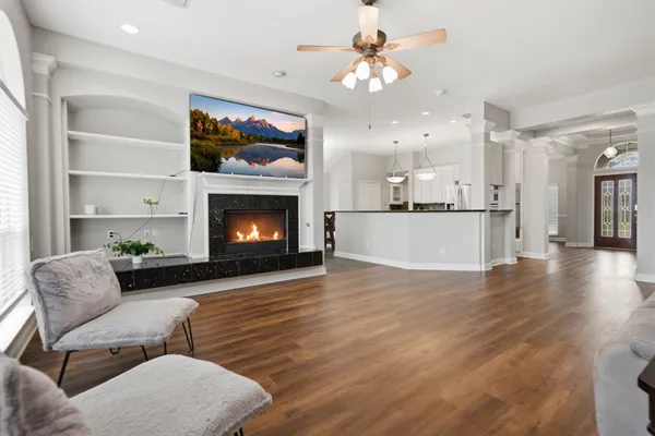a living room with furniture and a fireplace