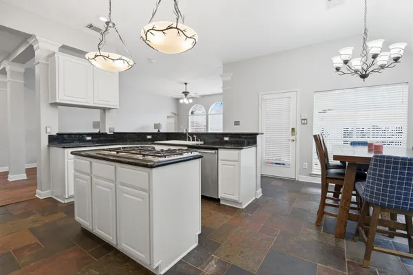 a kitchen with a counter space cabinets and stainless steel appliances