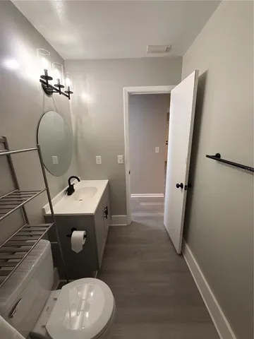 a bathroom with a sink and mirror