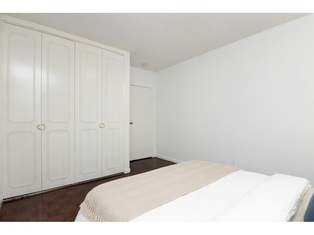 132 Lake Shore Road, Unit 1 Boston, MA 02135 - Photo 23 of 31 a bedroom with a bed and a shower