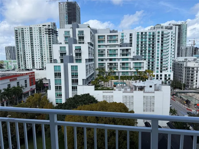 a view of balcony with wooden floor