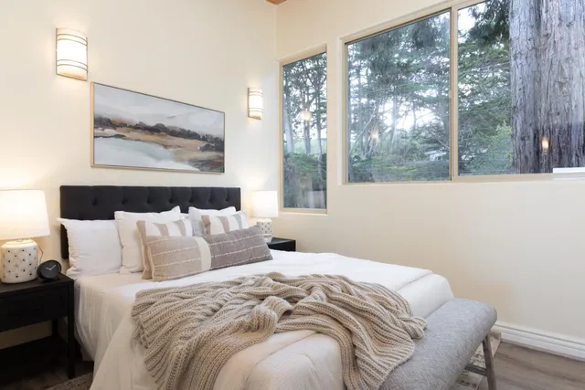 a bathroom with a granite countertop toilet sink and shower
