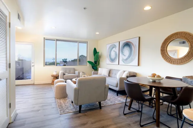 a view of a kitchen area kitchen island dining table and chairs