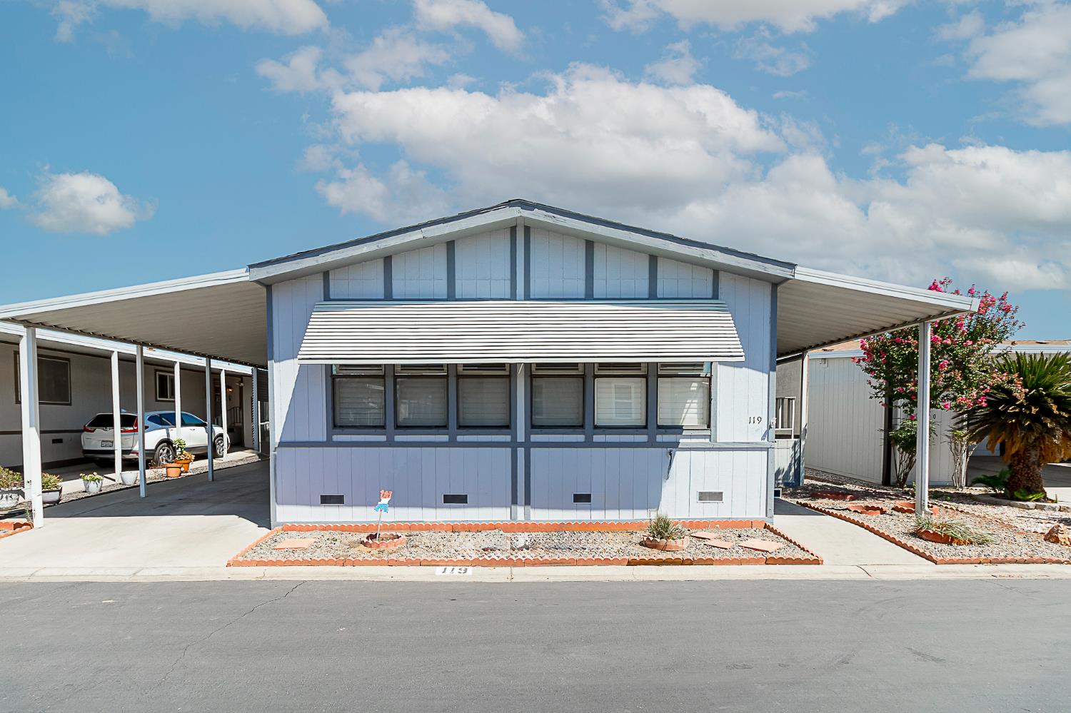 a front view of a house with a basket ball court