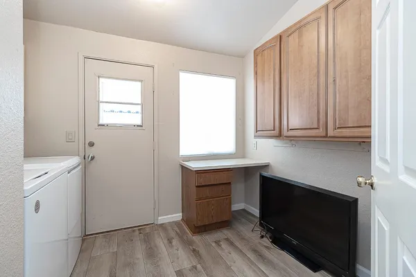 a room with cabinets and a wooden floor