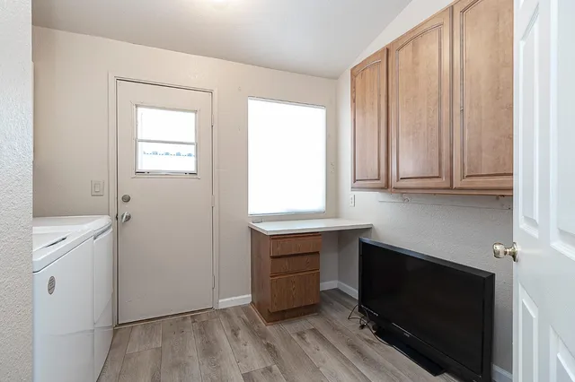 a room with cabinets and a wooden floor