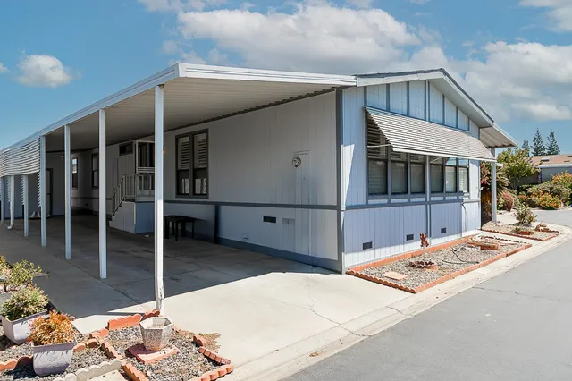 a balcony with table and chairs