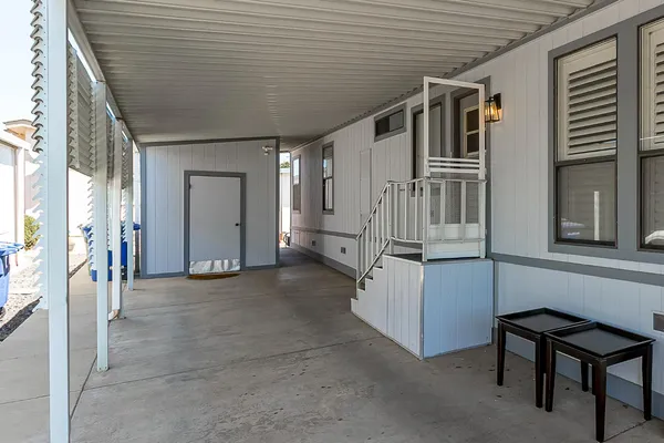 a view of a house with more chairs and refrigerator