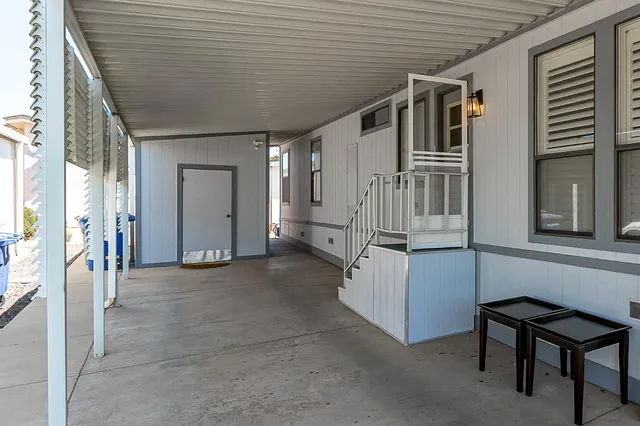 a view of a house with more chairs and refrigerator