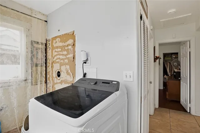 a kitchen with a sink and a refrigerator