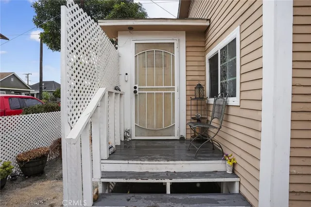 a view of front door of house with stairs