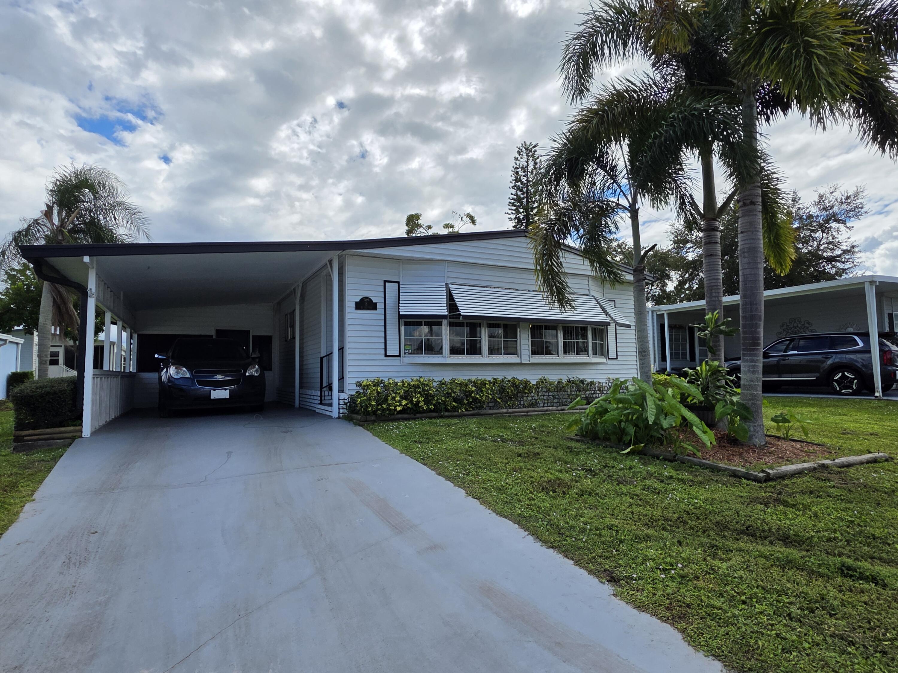 a view of a house with a back yard