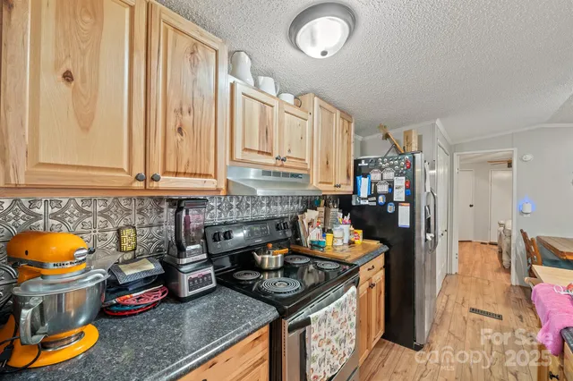 a room with furniture a flat screen tv and a table