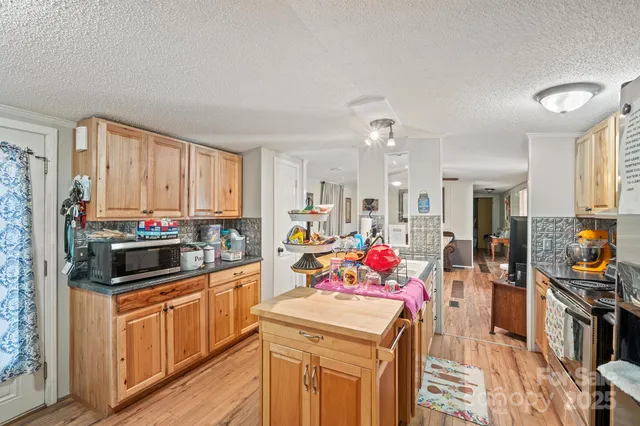 a bathroom with a sink a toilet and shower curtain