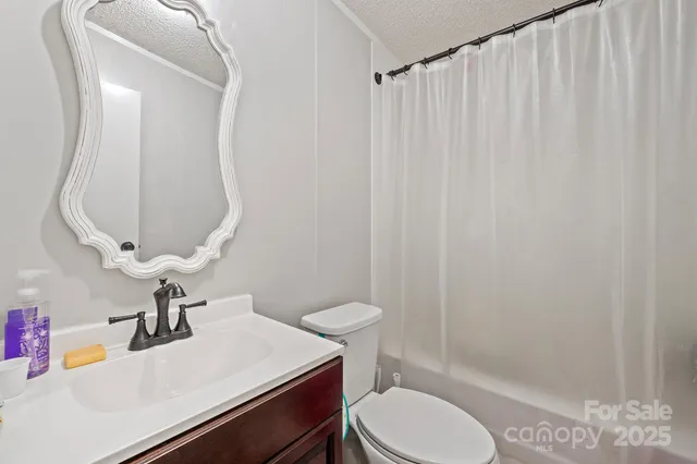 a bedroom with furniture and a large window