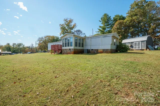a view of a house with a yard and garage