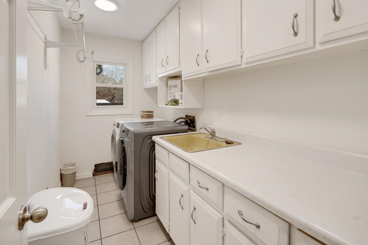 455 Burley Road Collierville, TN 38017 - Photo 15 of 25 a kitchen with cabinets appliances a sink and a counter top space