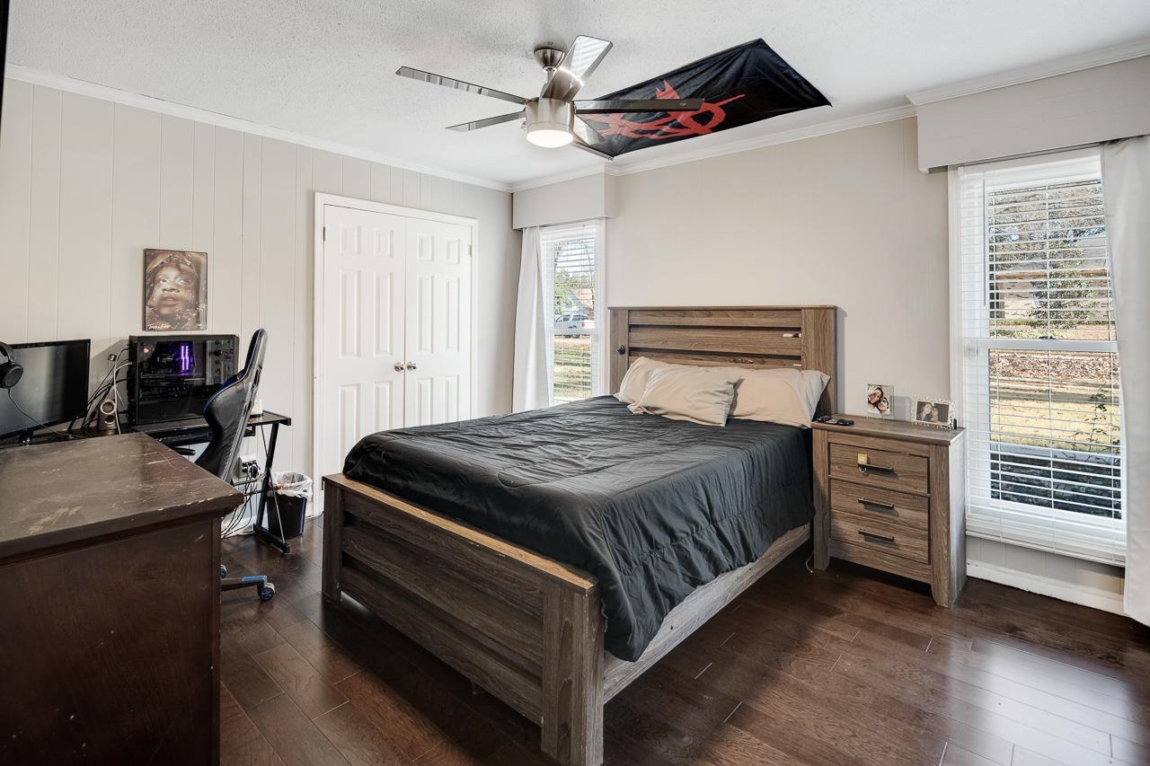 455 Burley Road Collierville, TN 38017 - Photo 16 of 25 a bedroom with a bed and a chandelier