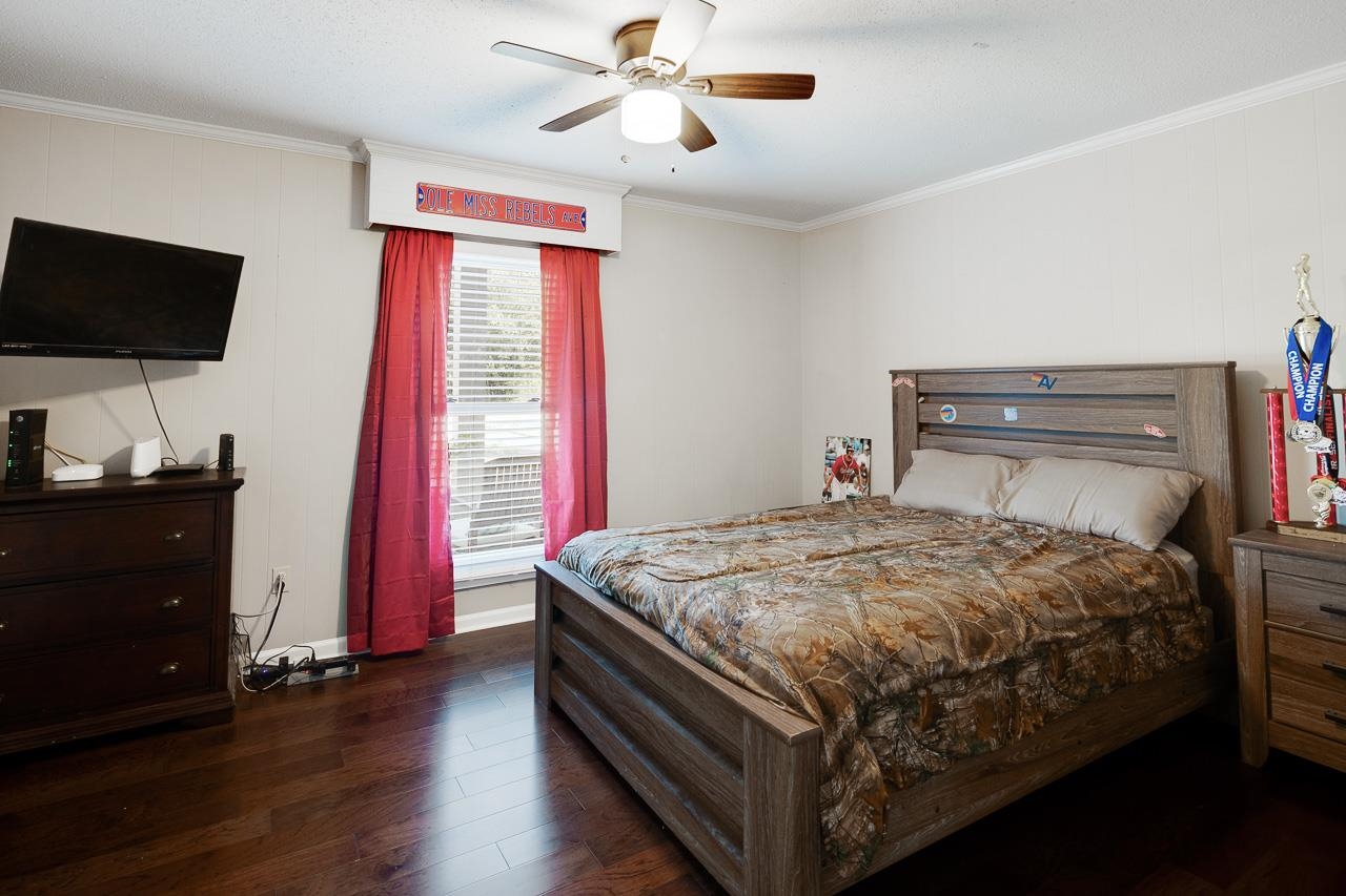 455 Burley Road Collierville, TN 38017 - Photo 17 of 25 a bed sitting in a bedroom next to a window