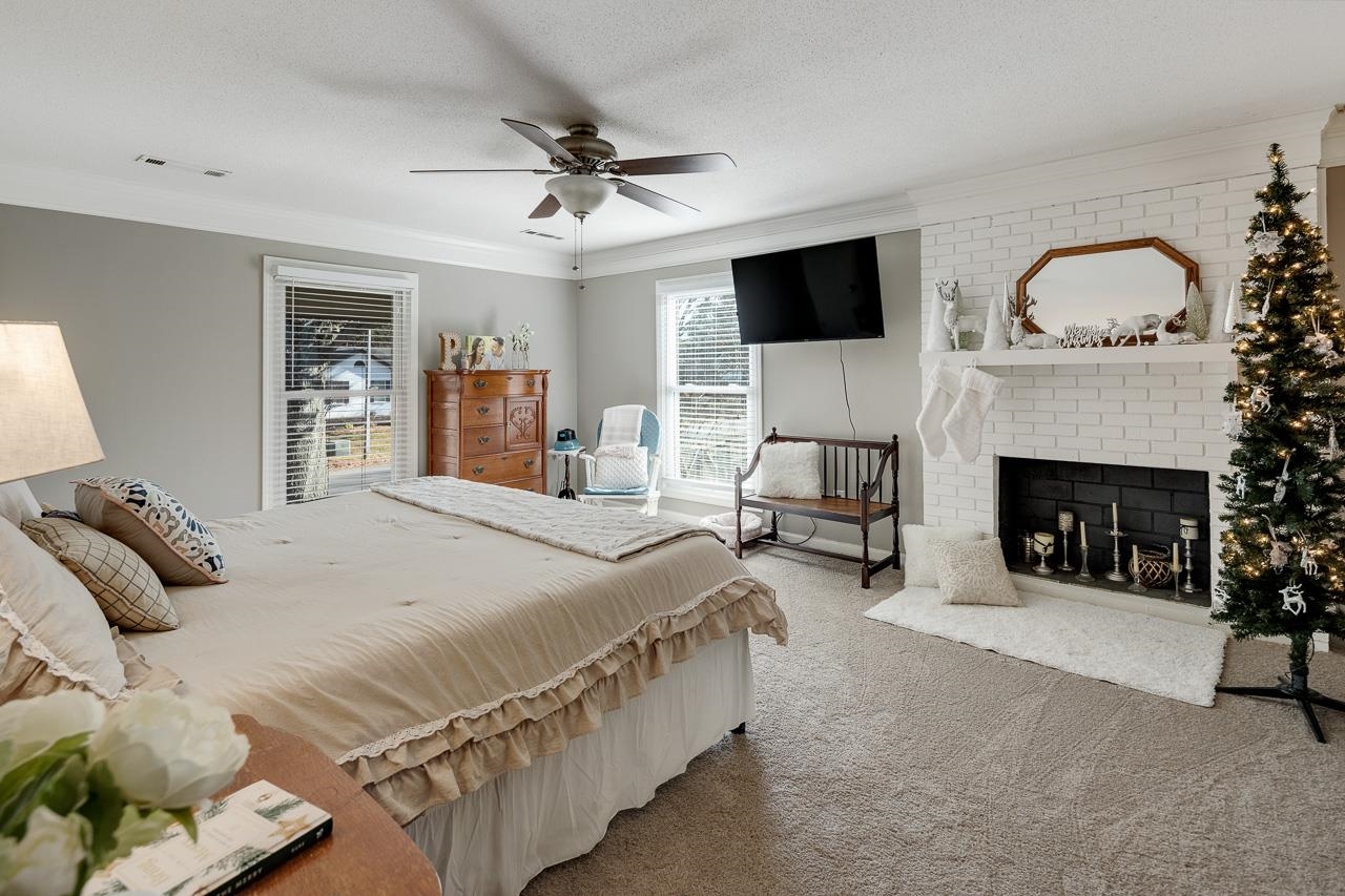 455 Burley Road Collierville, TN 38017 - Photo 18 of 25 a bedroom with a bed and a fireplace