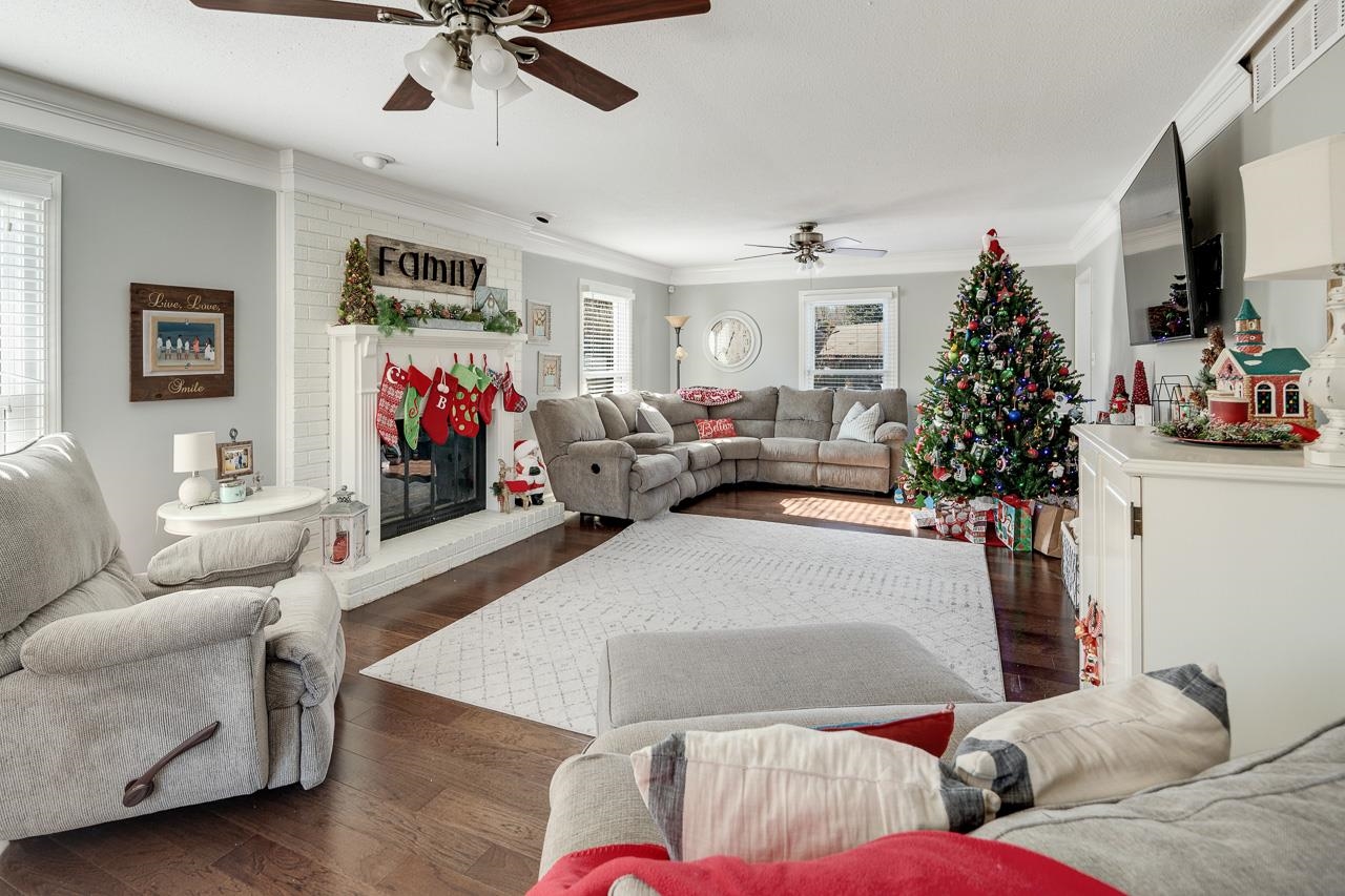 455 Burley Road Collierville, TN 38017 - Photo 3 of 25 a living room with furniture and a flat screen tv