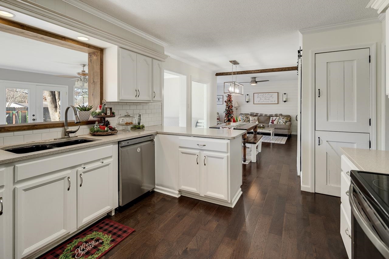 455 Burley Road Collierville, TN 38017 - Photo 8 of 25 a kitchen with sink cabinets and wooden floor
