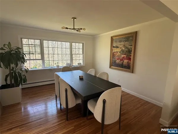 a kitchen with stainless steel appliances kitchen island granite countertop a stove a refrigerator and a sink