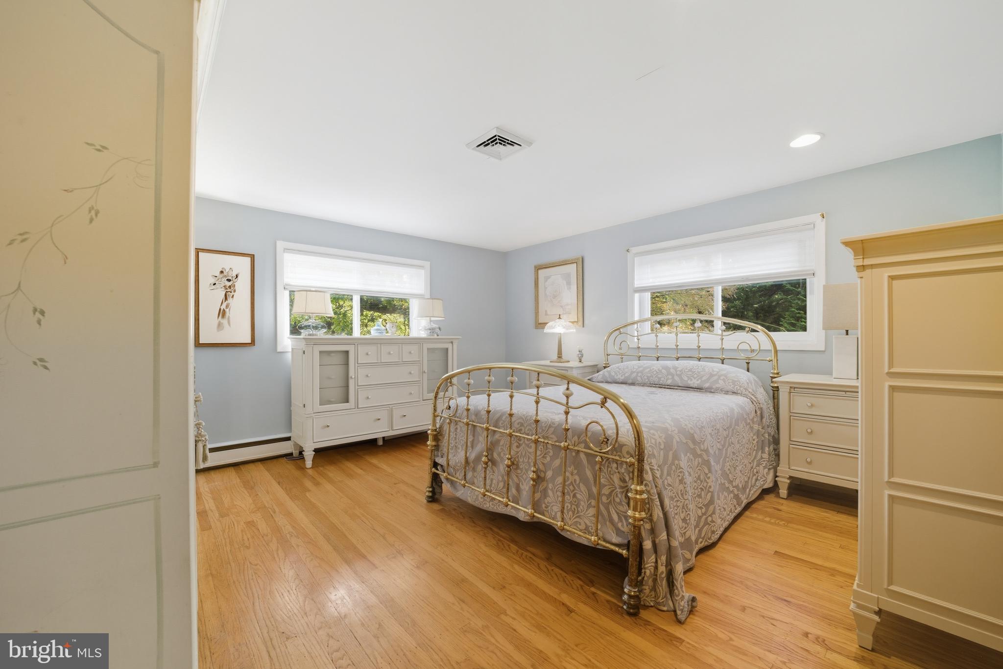 328 Conestoga Road Devon, PA 19333 - Photo 23 of 35 a bedroom with a bed and wooden floor