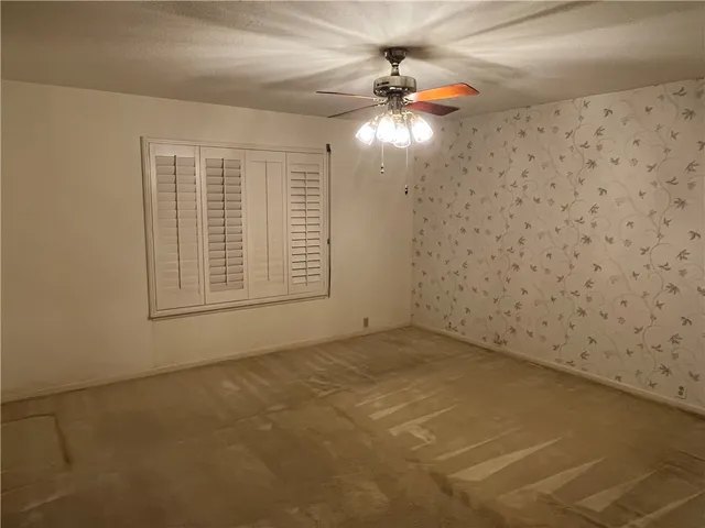a view of a bathroom with a sink and a mirror