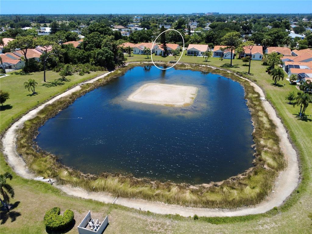 4266 Summertree Road Venice, FL 34293 - Photo 42 of 64 a view of a swimming pool with outdoor seating